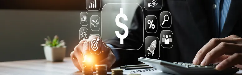 Businessperson using calculator with digital financial icons and stacked coins on desk.