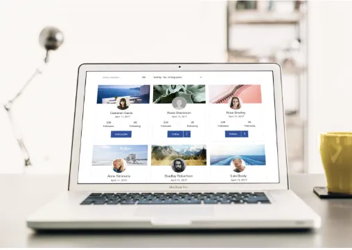 Laptop displaying a social media profile grid with user photos and follow buttons.