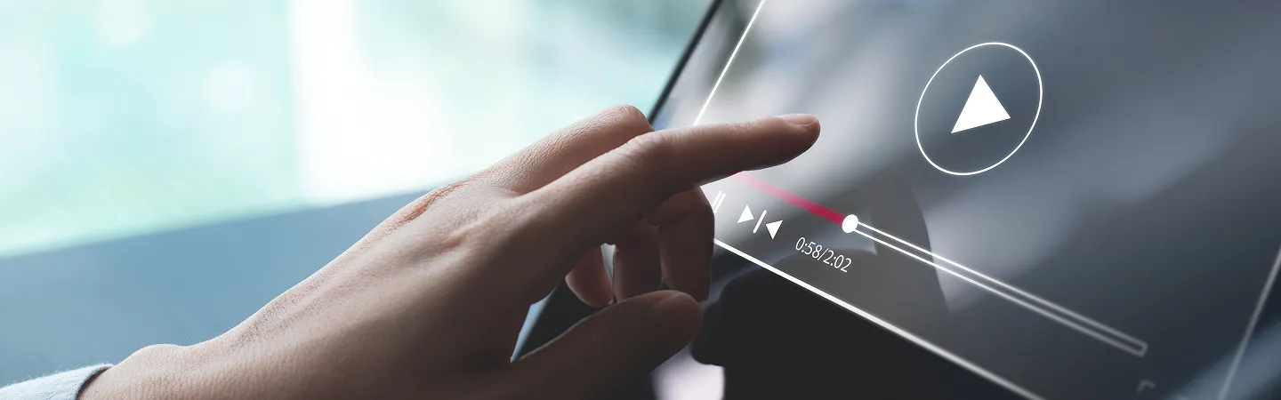 Close-up of a hand interacting with a transparent digital video player interface on a screen.