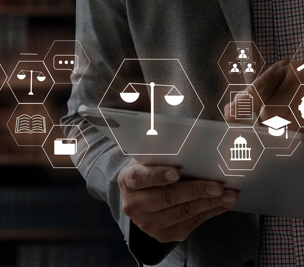 Person holding tablet with floating legal and educational icon overlays in hexagons.